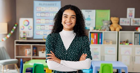 Smiling teacher in her classroom